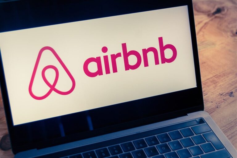 Airbnb logo displayed on computer laptop screen