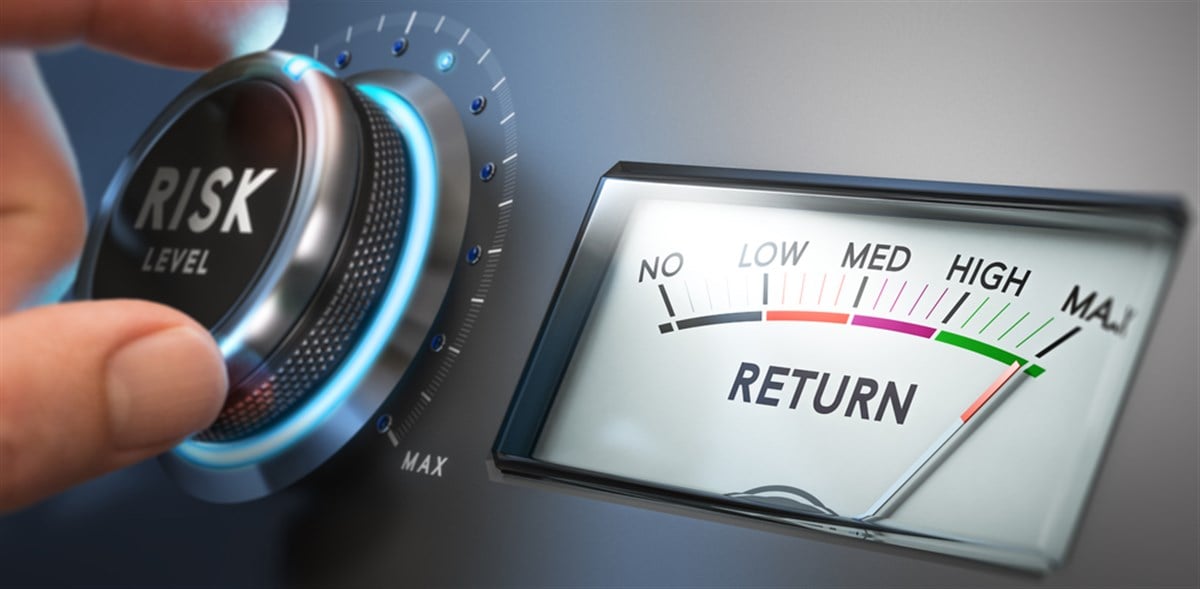 Photo of a man turning a risk selector button. Risk assessment is key to making sound investment decisions.