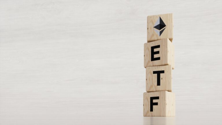 EDITORIAL, Exchange Traded Fund (ETF) and Ethereum cryptodivisa concept. Introduce the concept of digital money background. Wooden vertical cube with bitcoin icon standing with "ETF" text.