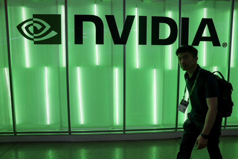 © Reuters. FILE PHOTO: A person walks pass a Nvidia logo at Computex in Taipei, Taiwan June 5, 2024. REUTERS/Ann Wang/File Photo © Reuters. FILE PHOTO: A person walks pass a Nvidia logo at Computex in Taipei, Taiwan June 5, 2024. REUTERS/Ann Wang/File Photo