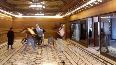 Syrian rebels carry furniture from presidential palace after Assad flees the country – video
