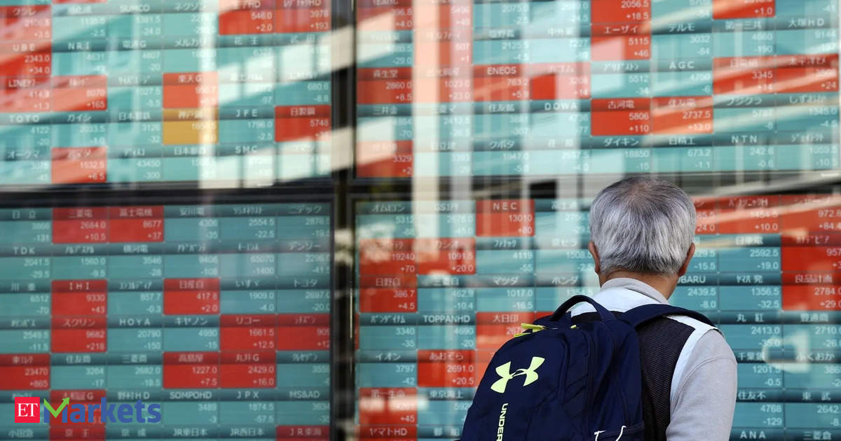 Asian shares mixed, dollar rallies in sign of caution