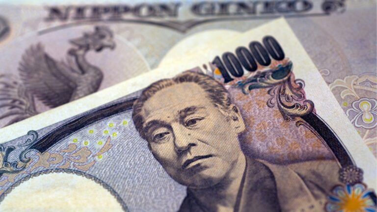 Bank of Japan maintains rate, yen hits 150