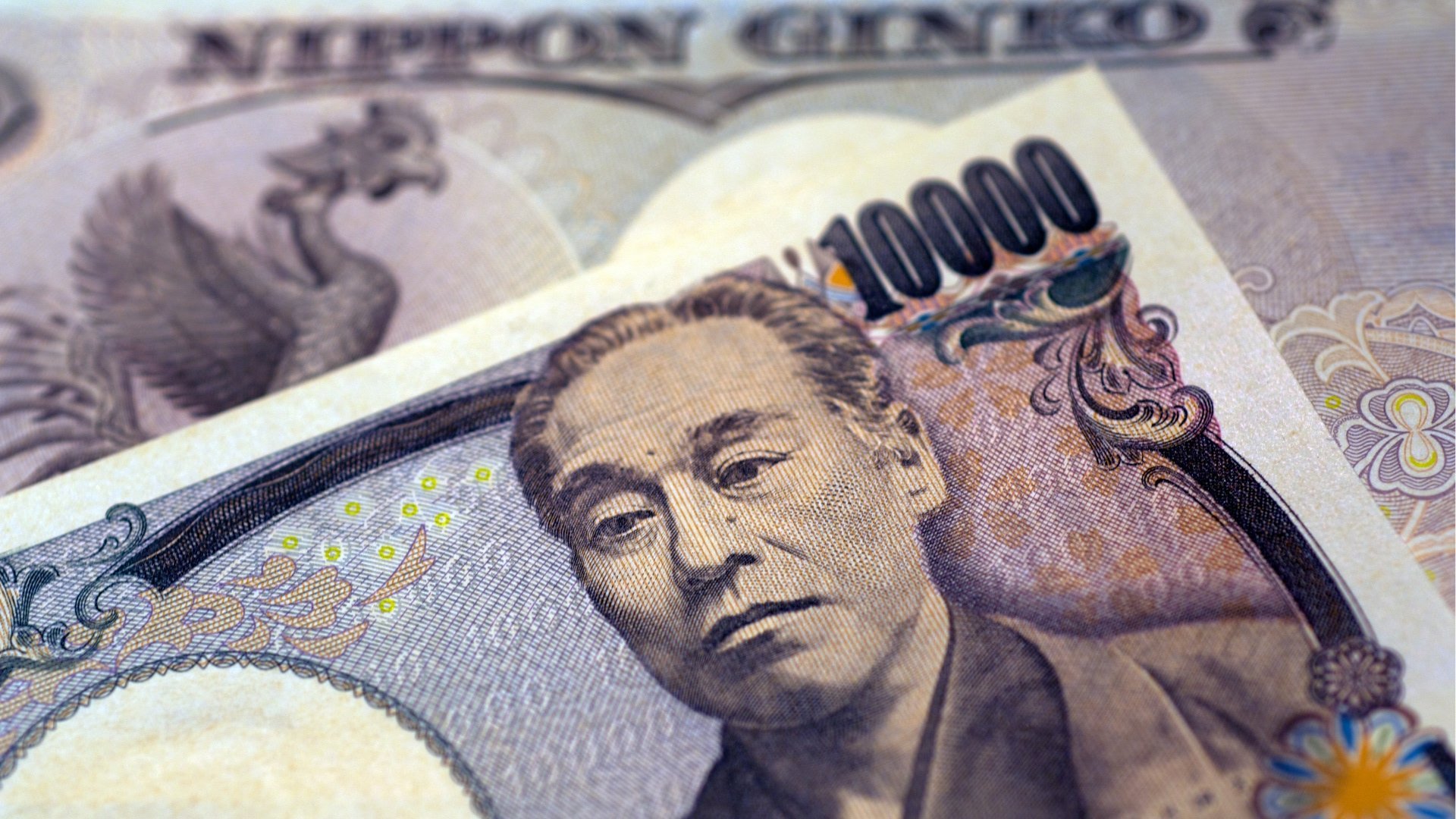 Bank of Japan maintains rate, yen hits 150