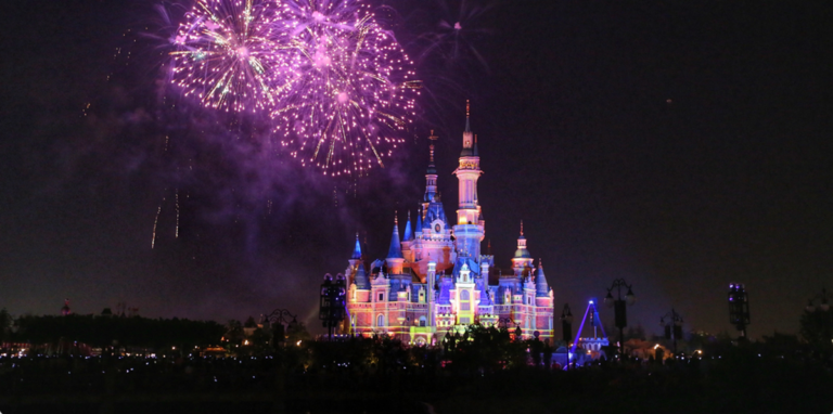 Fireworks explode over the Disney Castle