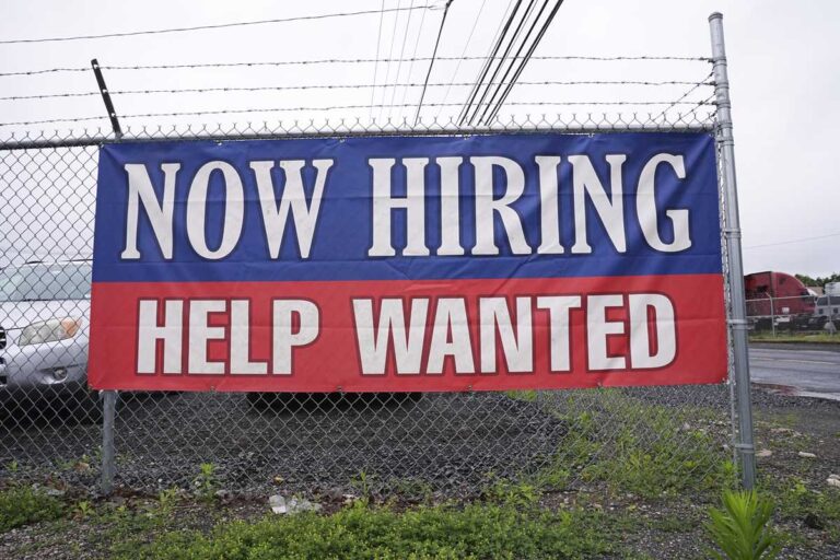 Fewer Americans sought unemployment benefits last week as layoffs remain low