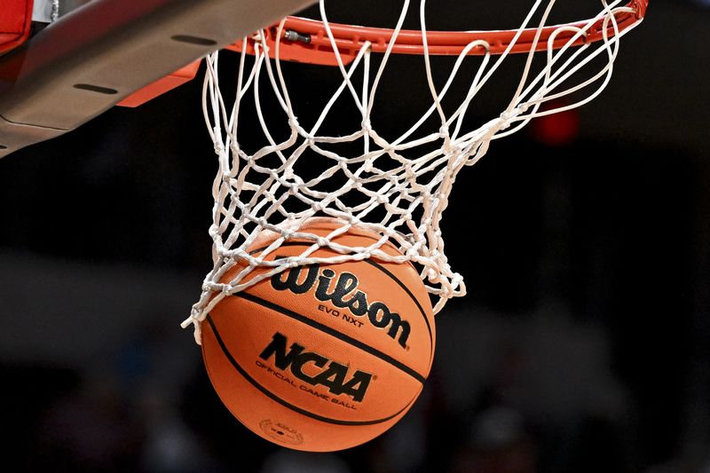 US judge approves settlement allowing NCAA schools to pay athletes