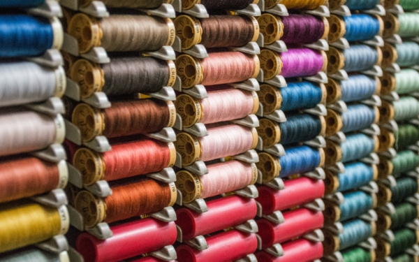 India faces a 10% base tariff, but textile exports attract up to 26% due to category-wise differences.
