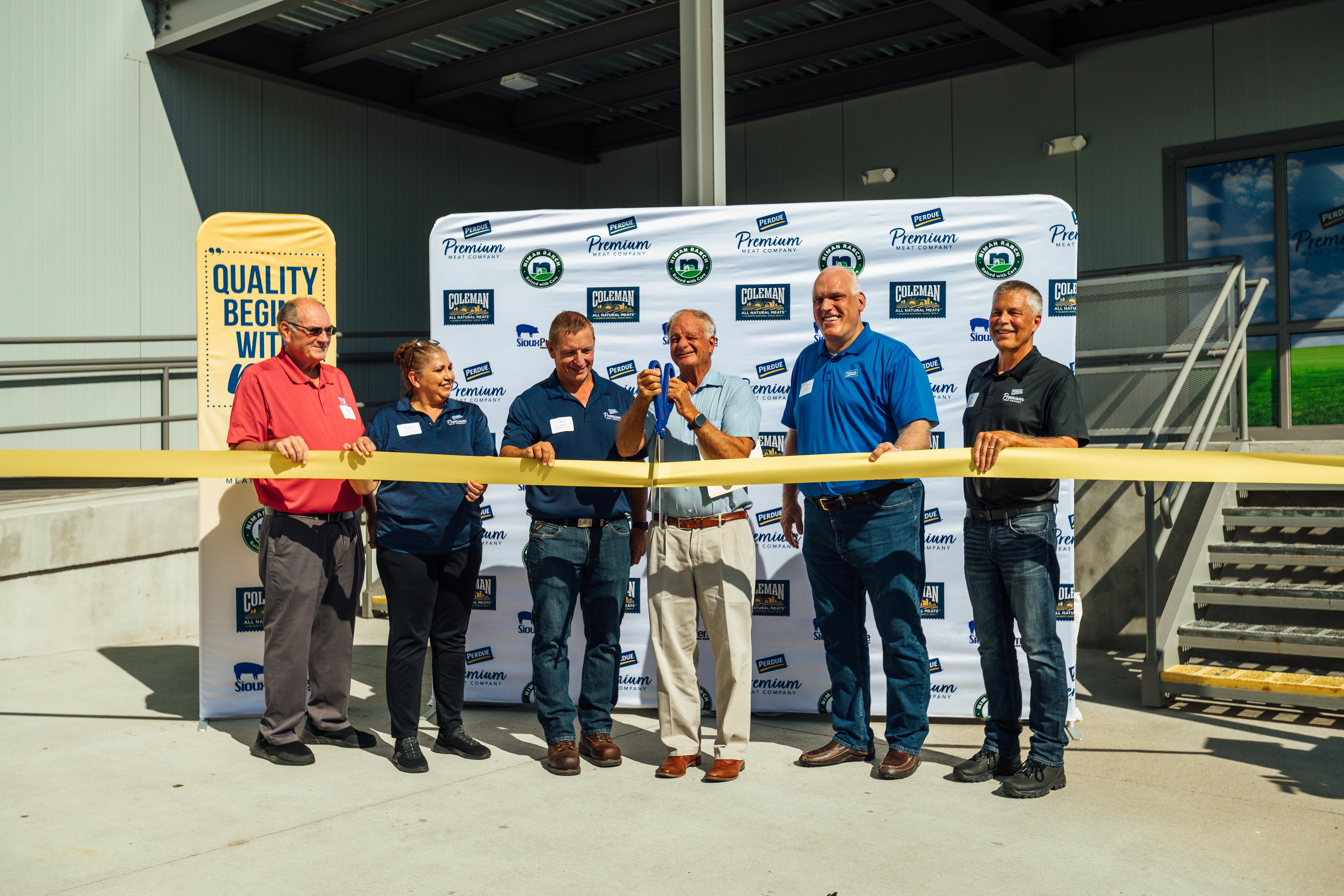 Perdue Premium Meat Company executives and operations leaders hosted a ribbon-cutting ceremony to formally open their new 225,000 square-foot case-ready pork production facility alongside local officials and community members. Pictured here from left to right: Bob Scott, Mayor, Sioux City; Rogelia Talamentes, Associate Relations Representative, Perdue Premium Meat Company; Rick Getman, Vice President of Plant Operations, Perdue Premium Meat Company; Jim Perdue, Chairman of the Board, Perdue Farms; Kevin McAdams, CEO, Perdue Farms; Gary Malenke, Senior Vice President of Operations, Perdue Premium Meat Company.