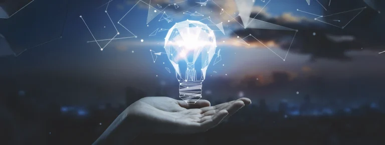 Business idea concept with hand holding 3d geometric light bulb at abstract city background.