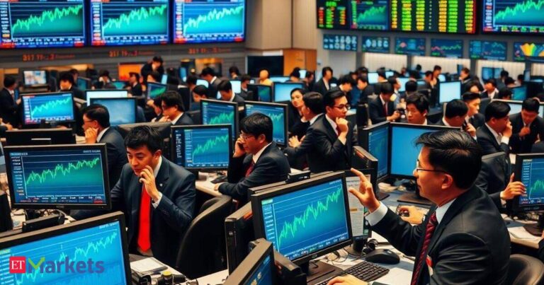 Asian stocks edge lower after mixed Fed signals