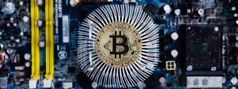Gold bitcoin with microcircuits on a blue background