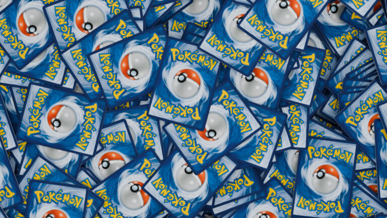 A pile of Pokemon Trading Cards, with the card backs showing, English TCG version