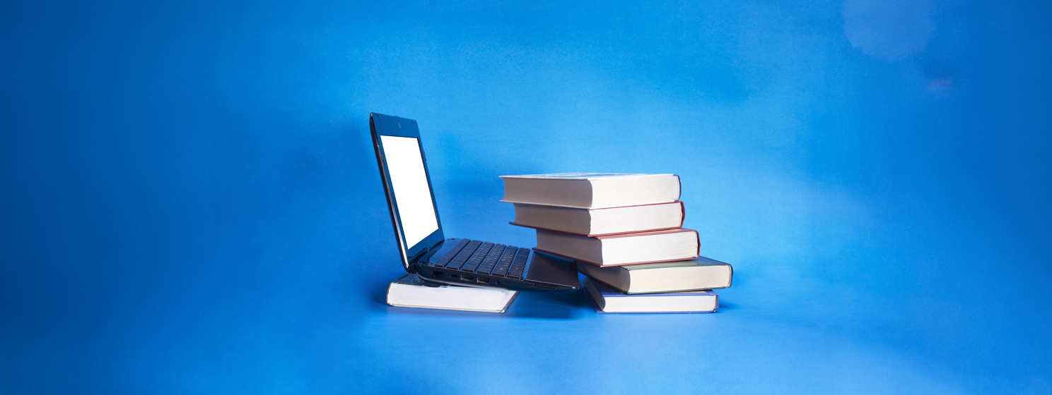 Laptop and pile of books