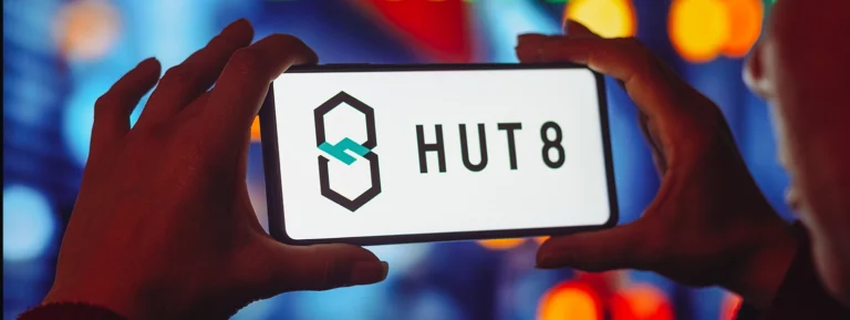 Hut 8 Mining logo seen displayed on a smartphone screen.