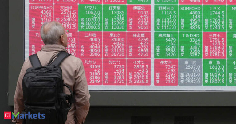 Japan's Nikkei buoyed by stable yen; SoftBank's slide caps gains