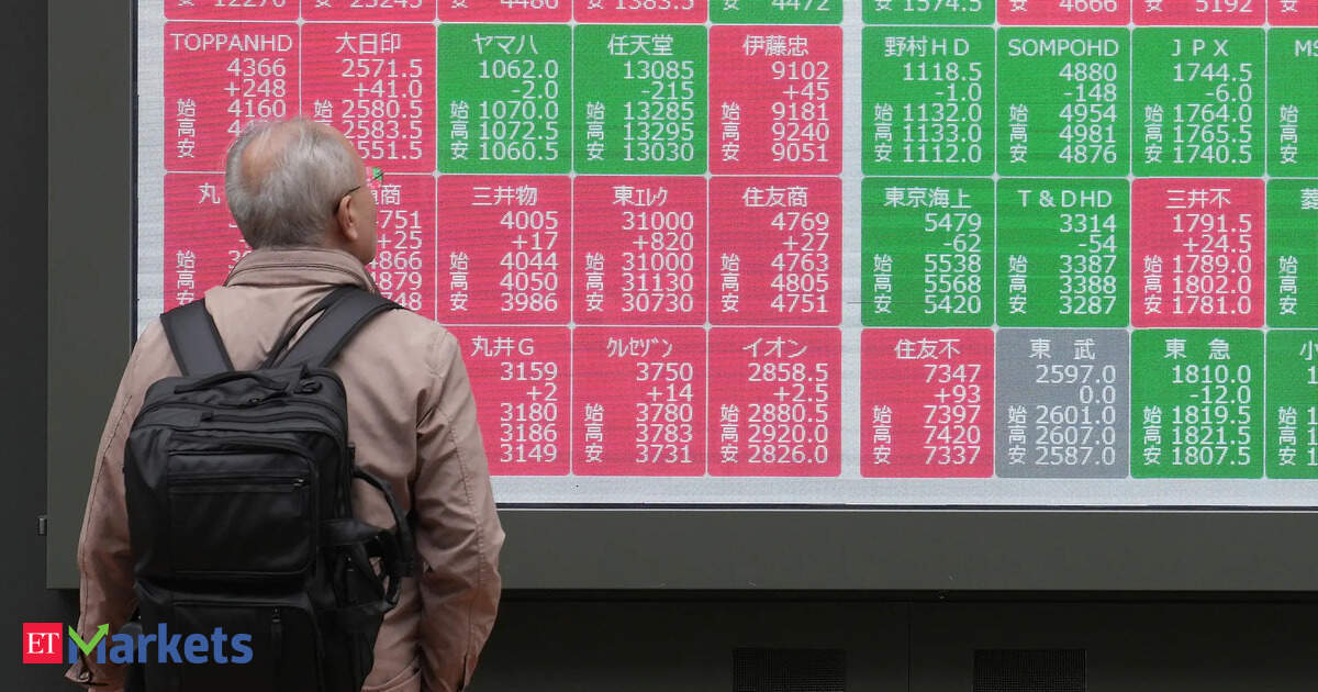 Japan's Nikkei buoyed by stable yen; SoftBank's slide caps gains