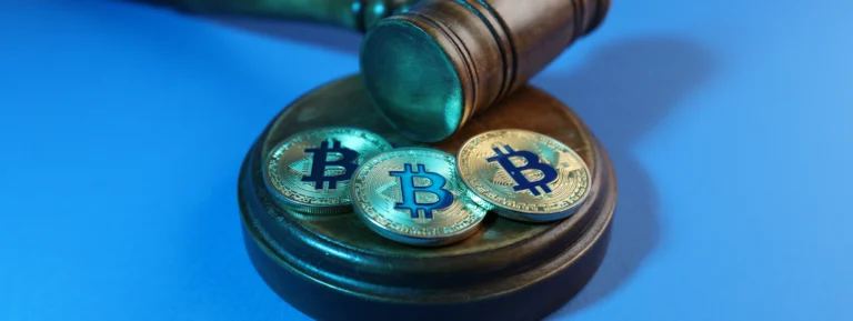 Cryptocurrency, Bitcoins and judge's gavel concept banner