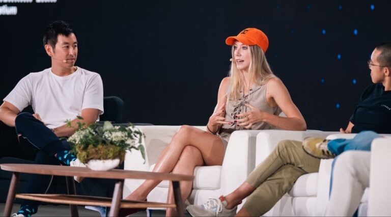 Kaledora Fontana Kiernan-Lin (in the middle) during the TOKEN2049 conference. Source: LinkedIn