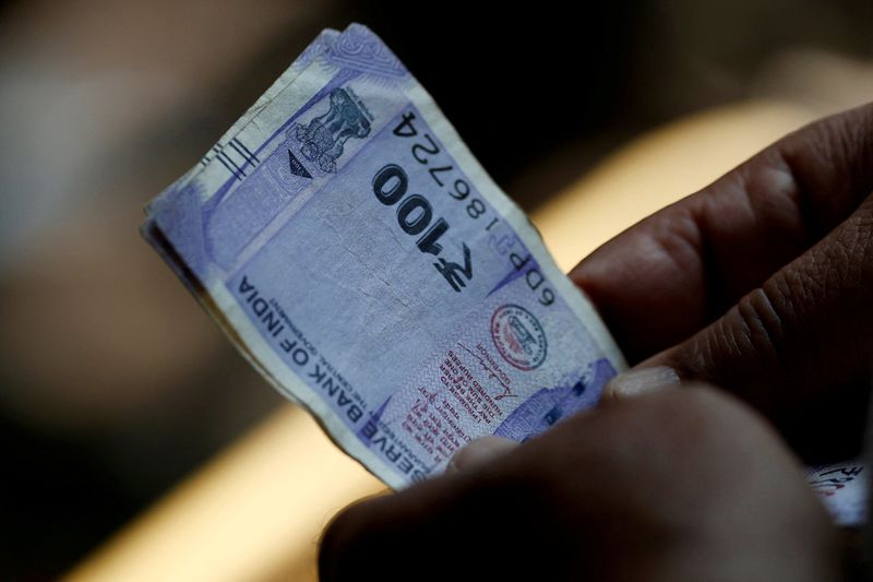 Indian rupee hits record low as oil surge pummels Asian assets