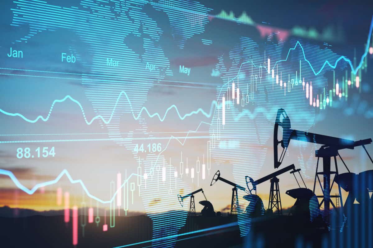 financial chart graphs and oil pumps on a field