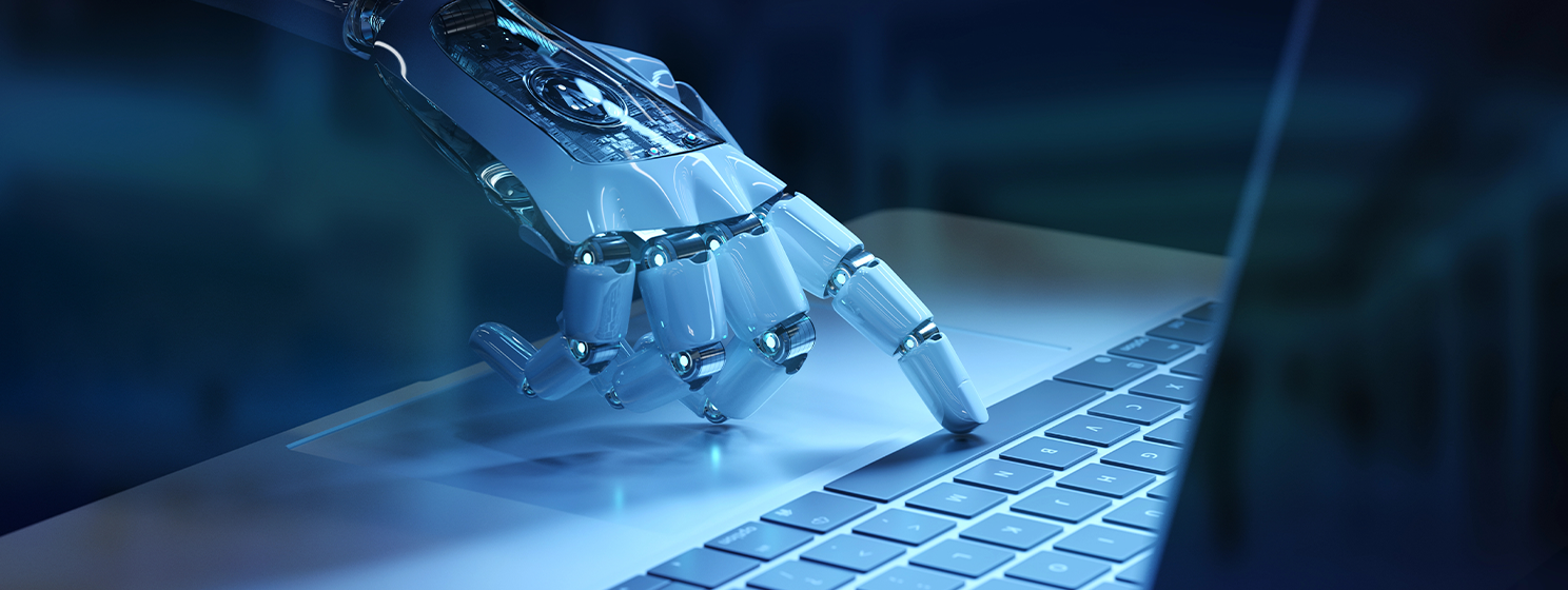 Cyborg hand pressing a keyboard on a laptop banner