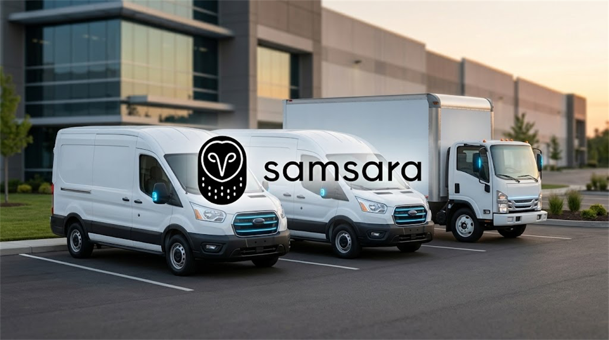 Samsara logo overlaid on three white commercial fleet vehicles parked outside a warehouse facility.