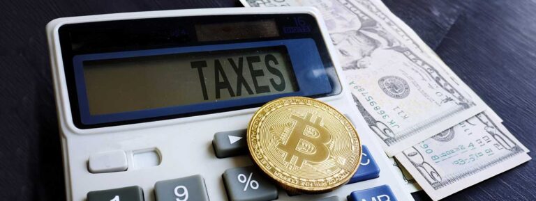 Calculator with word taxes and cryptocurrency coin
